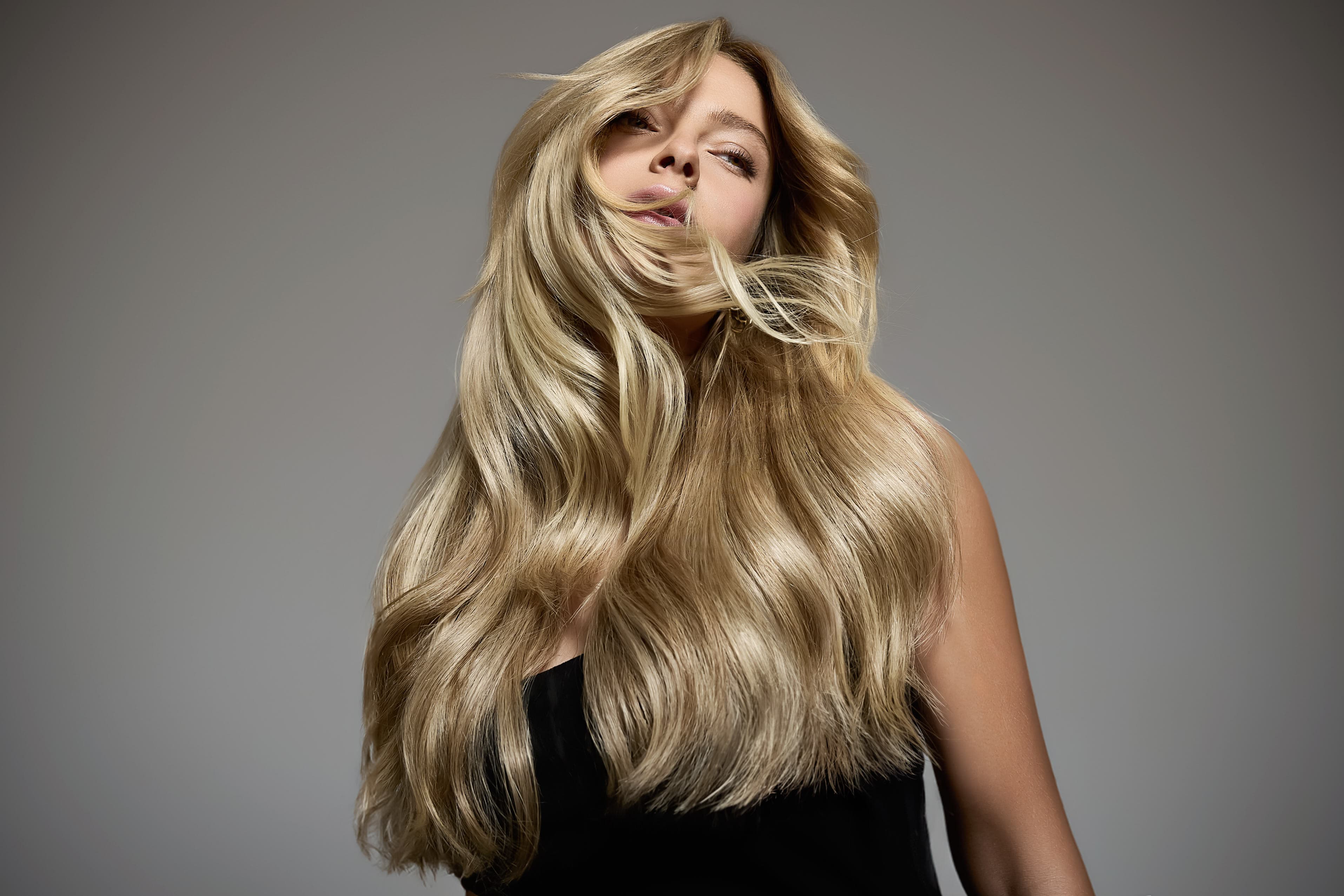 Keratin bond extensions — Sarah, wavy blonde hair